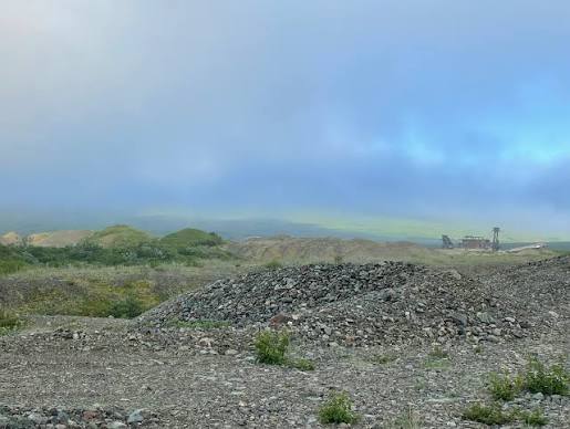 Real placer dredge and dragline tailing piles forming repeated artificial ridges